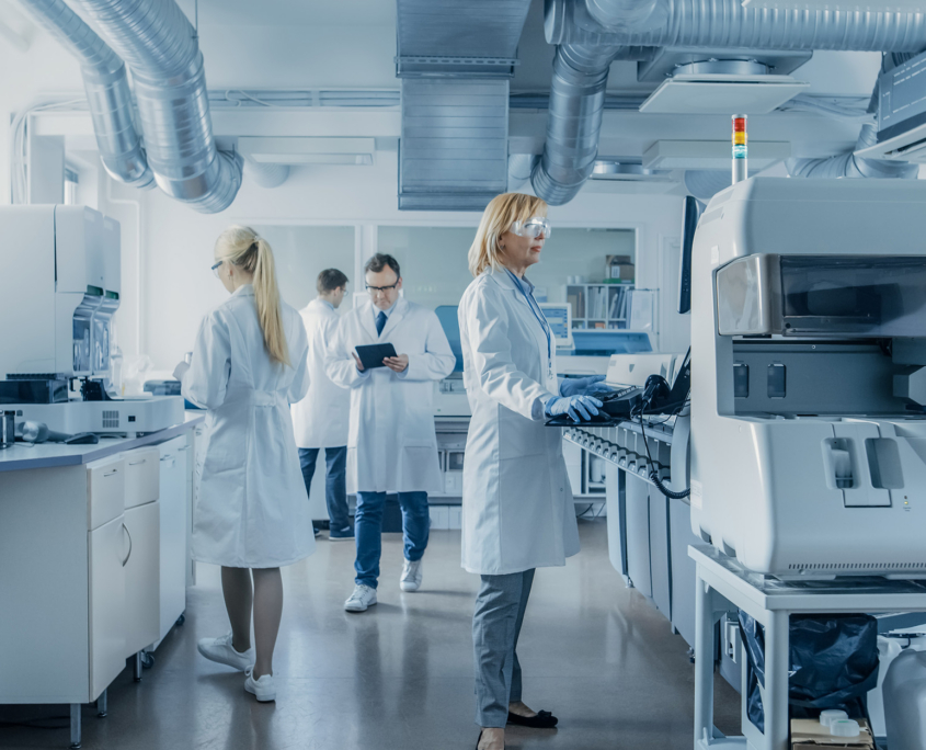 Team Of Research Scientists Working On Computer